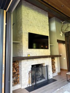 floor to ceiling white stone fireplace