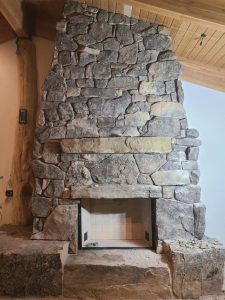 custom floor to ceiling fireplace stonework