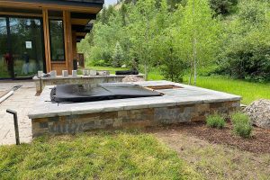 custom stone platform hot tub installation